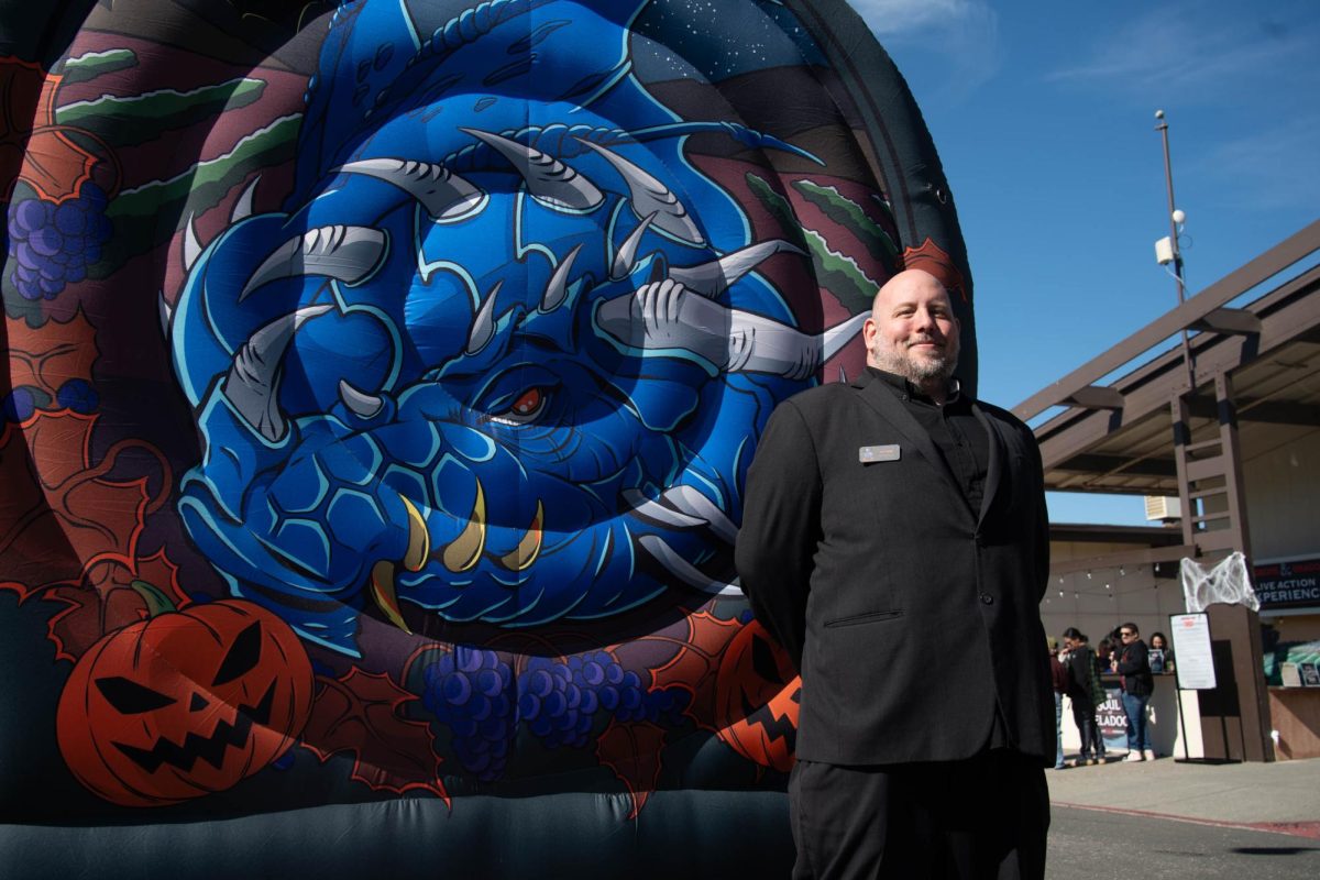 Event coordinator Joseph Sapp proudly stands in front of the Sonoma Con banner Oct. 4, at the Sonoma County Fairgrounds.