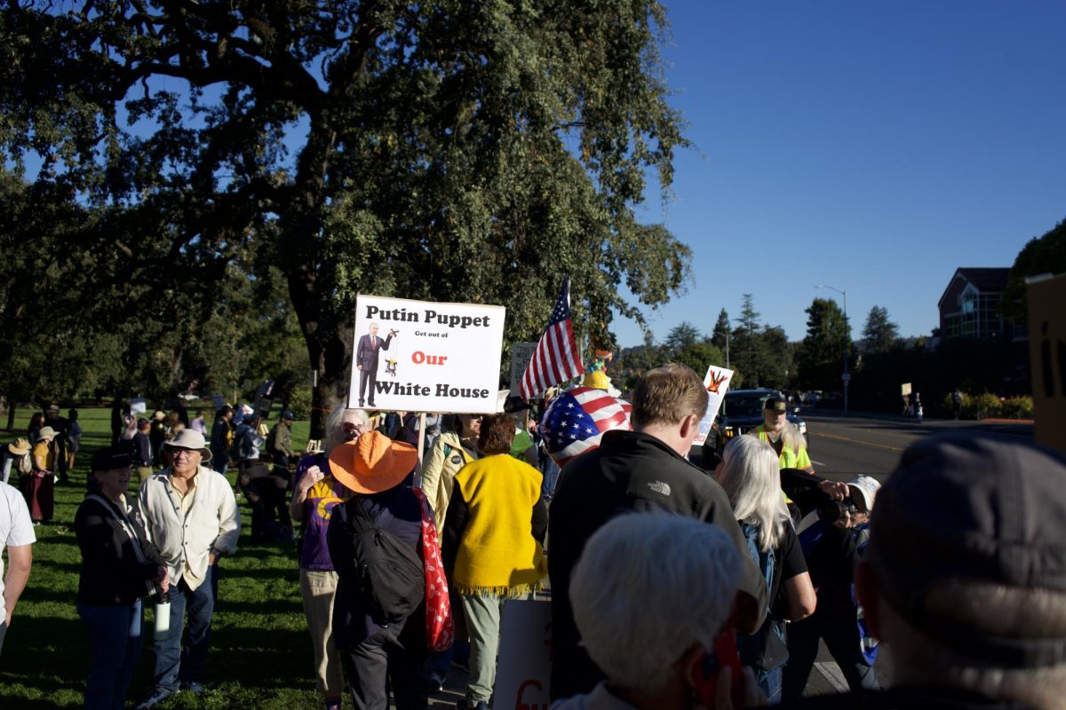 Community members gather on Mendocino Avenue to kick off a day of No Kings protests on Saturday Oct. 18. 