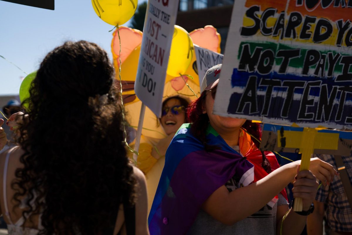 Demonstrators march with a colorful array of balloons, pride flags, animal costumes, and signs at a No Kings protest Saturday, Oct. 18, 2025 in Oakland, Calif.
