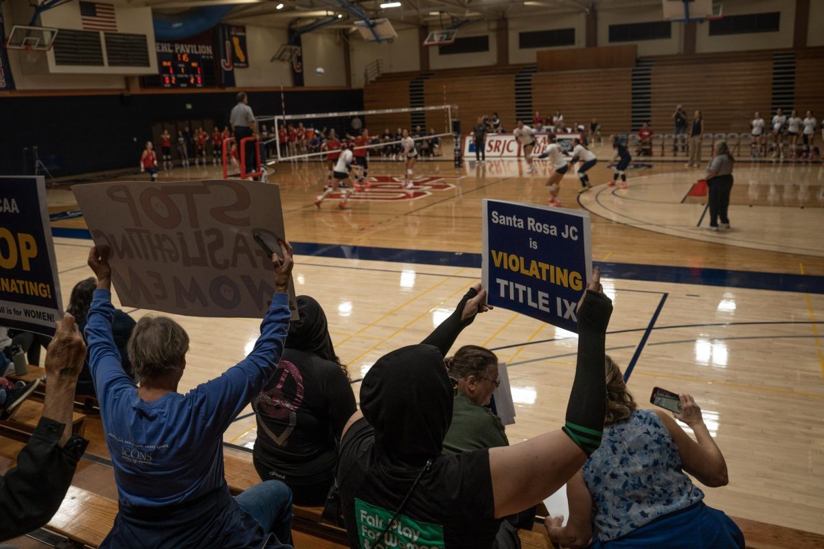 About a dozen anti-transgender demonstrators attend the SRJC women’s volleyball game to protest the transgender women's volleyball player Wednesday, Oct. 8 at the Haehl Pavilion. 