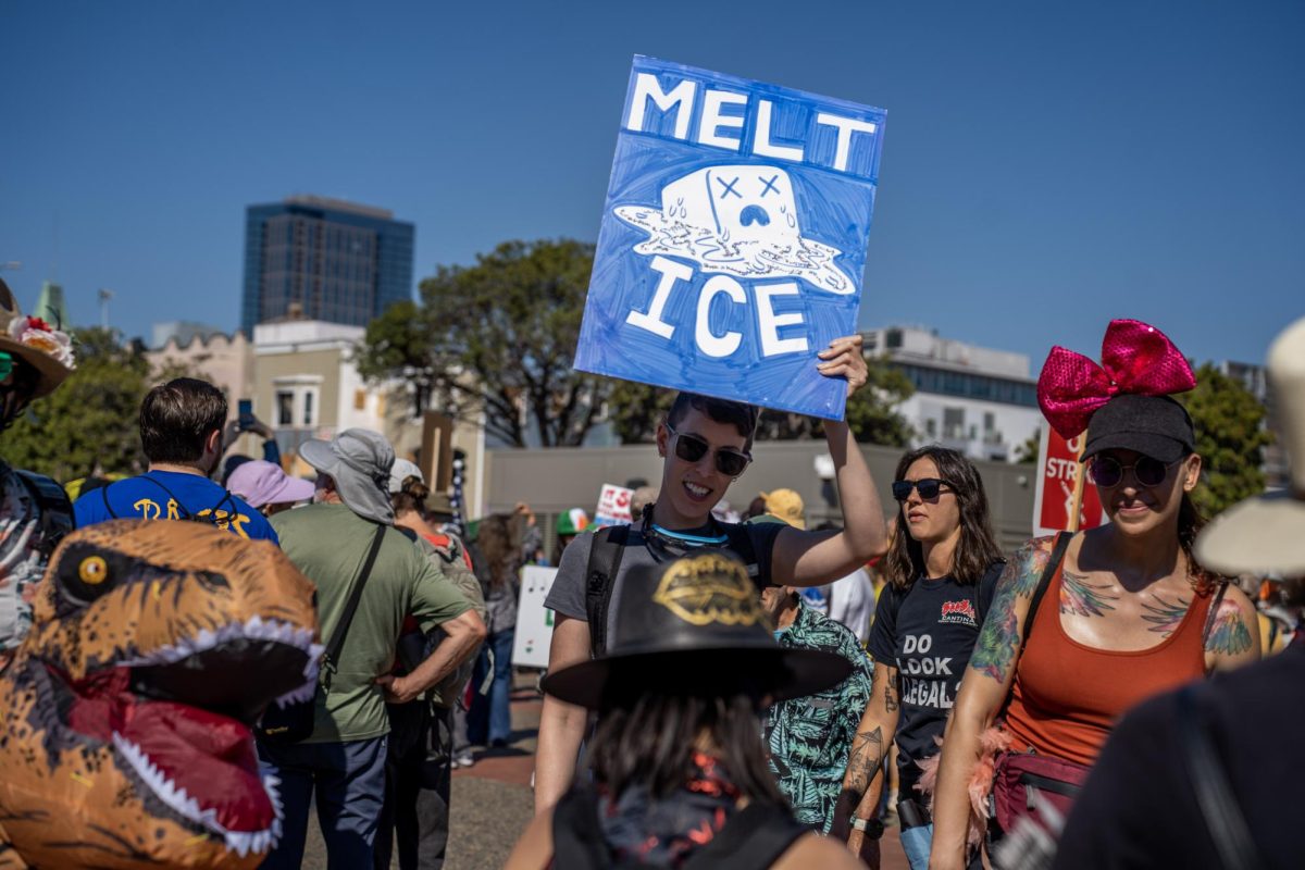 Dinosaurs and demonstrators rally against President Donald Trump’s policy to escalate ICE deportations across the nation at a No Kings protest Saturday, Oct. 18, 2025 in Oakland, Calif. 
