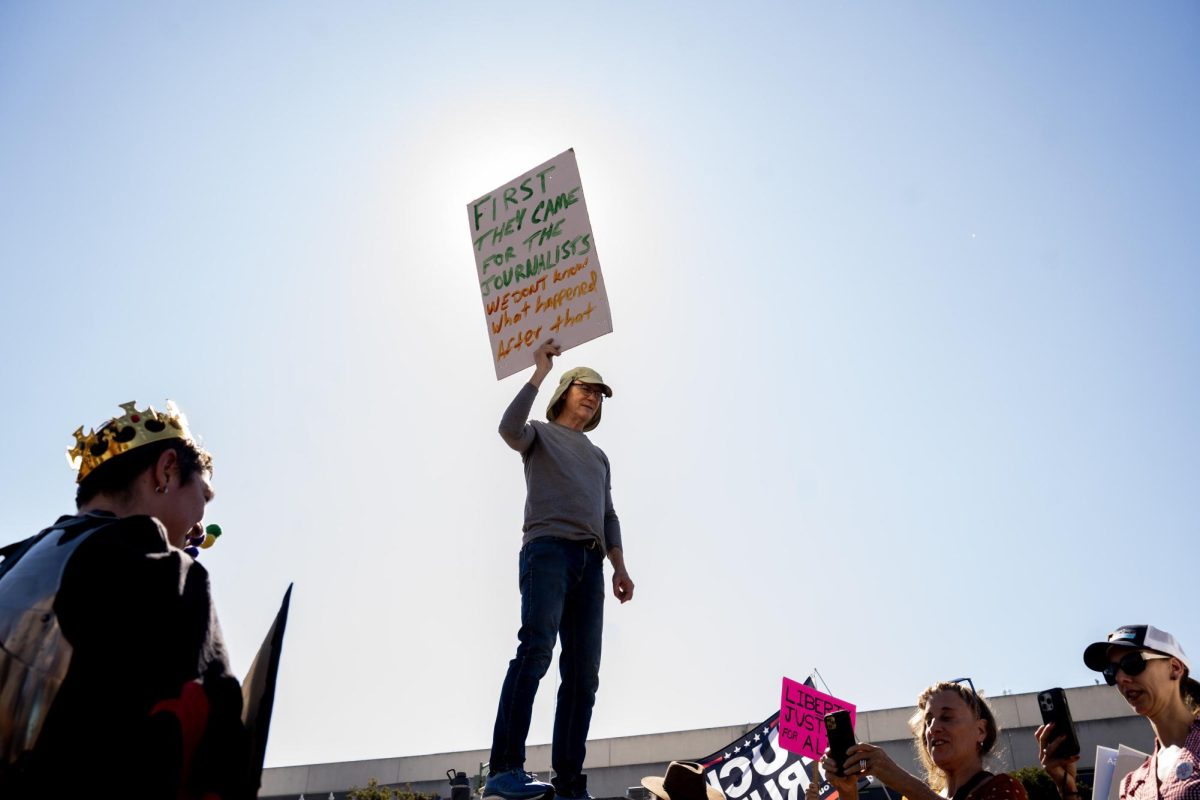 A demonstrator uses his sign to explore the consequences of President Donald Trump’s attempts to censor the press at a No Kings protest Saturday, Oct. 18, 2025 in Oakland, Calif. 
