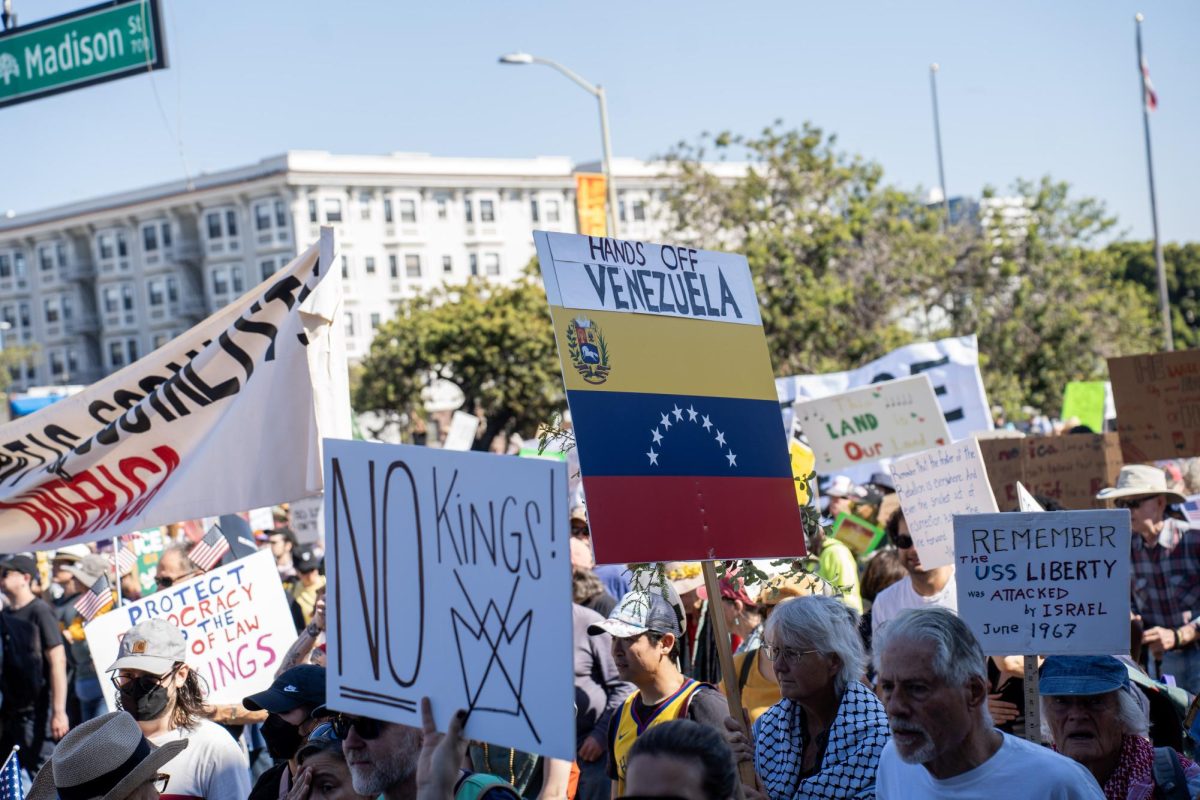 A protester reminds the crowd of President Donald Trump’s recent orders to attack and sink several Venezuelan boats unprovoked, claiming they were drug traffickers, at a No Kings protest Saturday, Oct. 18, 2025 in Oakland, Calif.
