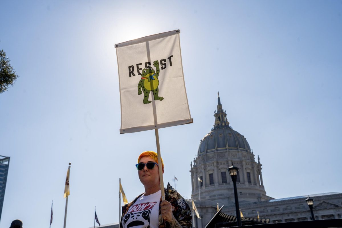 One of the millions of demonstrators who participated in the No Kings protests across the nation stands in front of San Francisco’s City Hall Saturday, Oct. 18, 2025 in San Francisco, Calif. 
