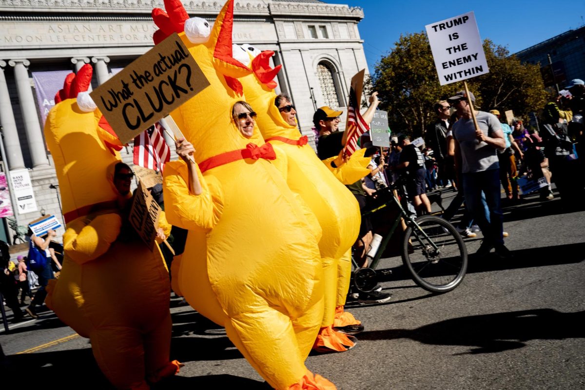 Demonstrators dress in inflatable chicken suits to express their feelings about President Donald Trump at a No Kings protest Saturday, Oct. 18, 2025 in San Francisco, Calif.
