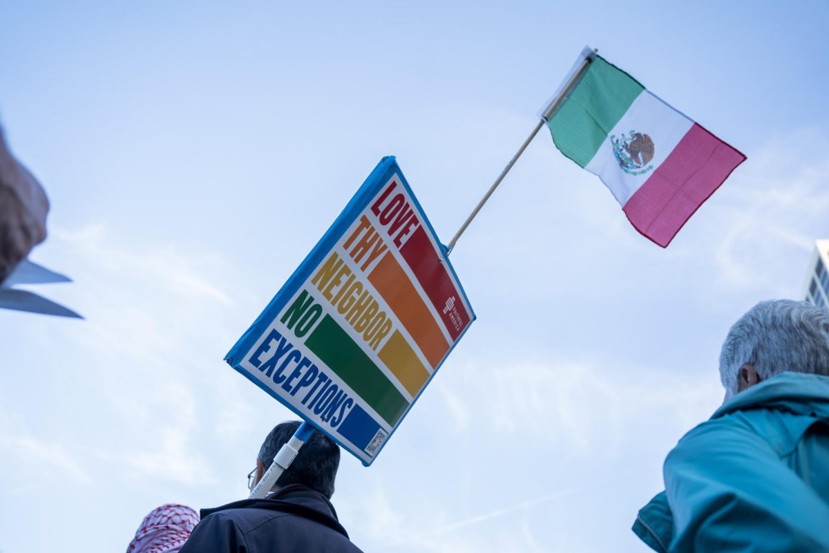 A demonstrators shows comradery to people of all walks of life at a protest on Thursday, Oct. 23 in San Francisco, Calif. 
