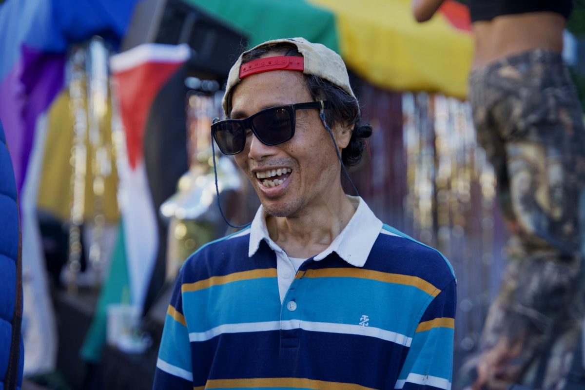 A Castro Street Fair attendee takes a break from dancing their heart out in front of the Queer AF Stage on Sunday Oct. 5, 2025. 