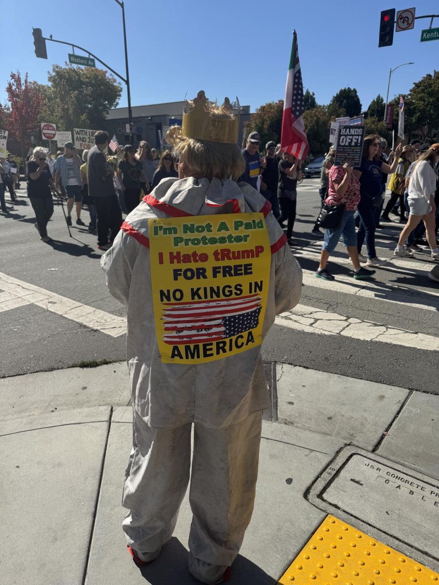 Petaluma protestor Demitri leads the pack with his megaphone and sign that reads, “I’m not a paid protestor, I hate Trump for free.” on No Kings day Oct. 18.