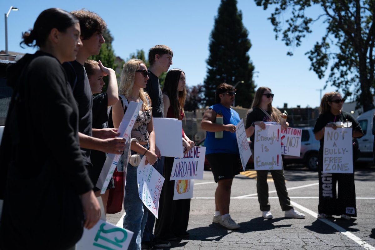 Protestors line up at the parking lot outside of the Robert Call Center, on Sept. 3, 2025.