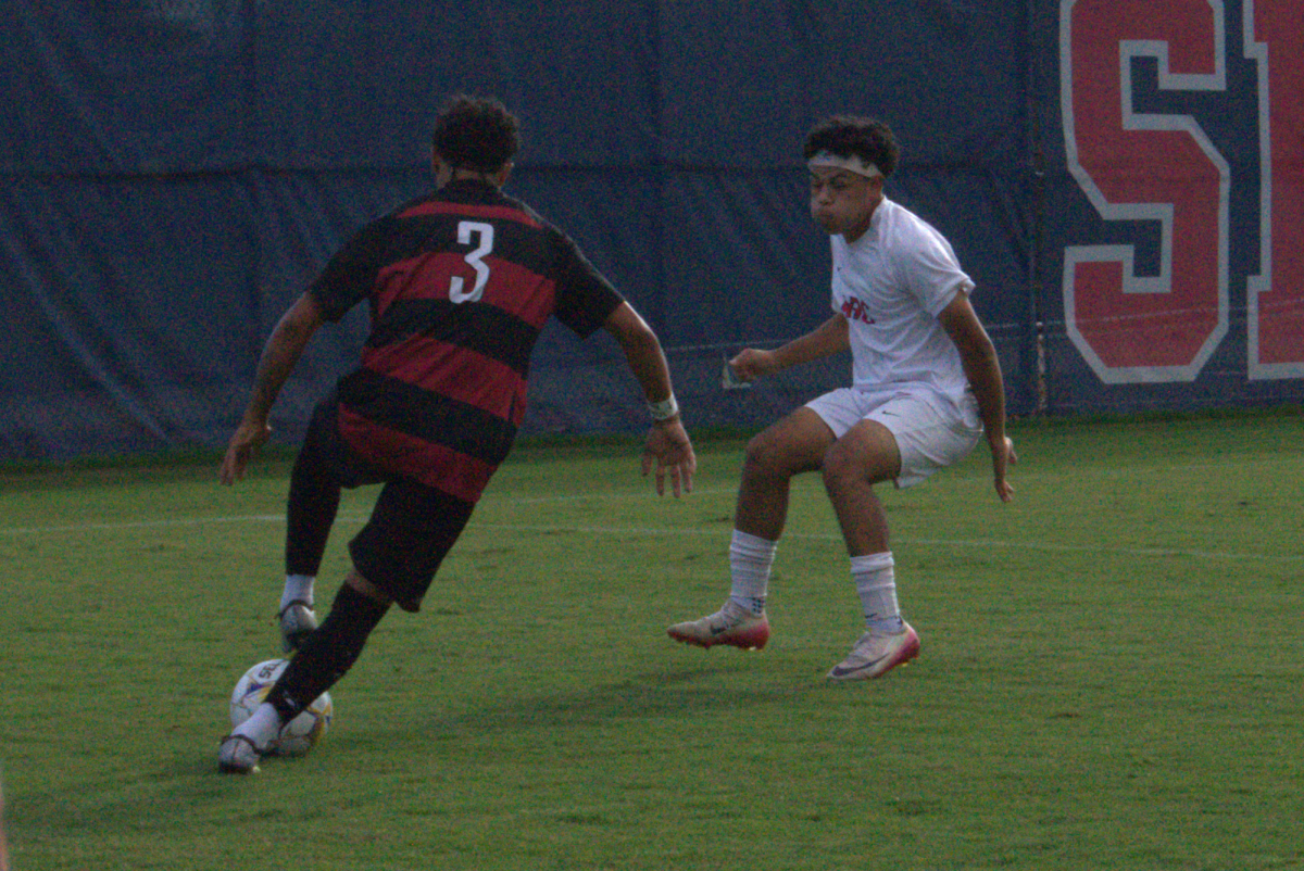 SRJC left back Raffino Lanford attempts to clear ARC center Daniel Sanchez at home Friday, Oct. 3, 2025.