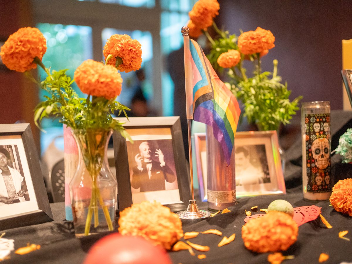 Photos of LGBTQIA ancestors are displayed on the Positive Images ofrenda during the SRJC Dia de los Muertos celebration in Bertolini Hall on Oct. 21.