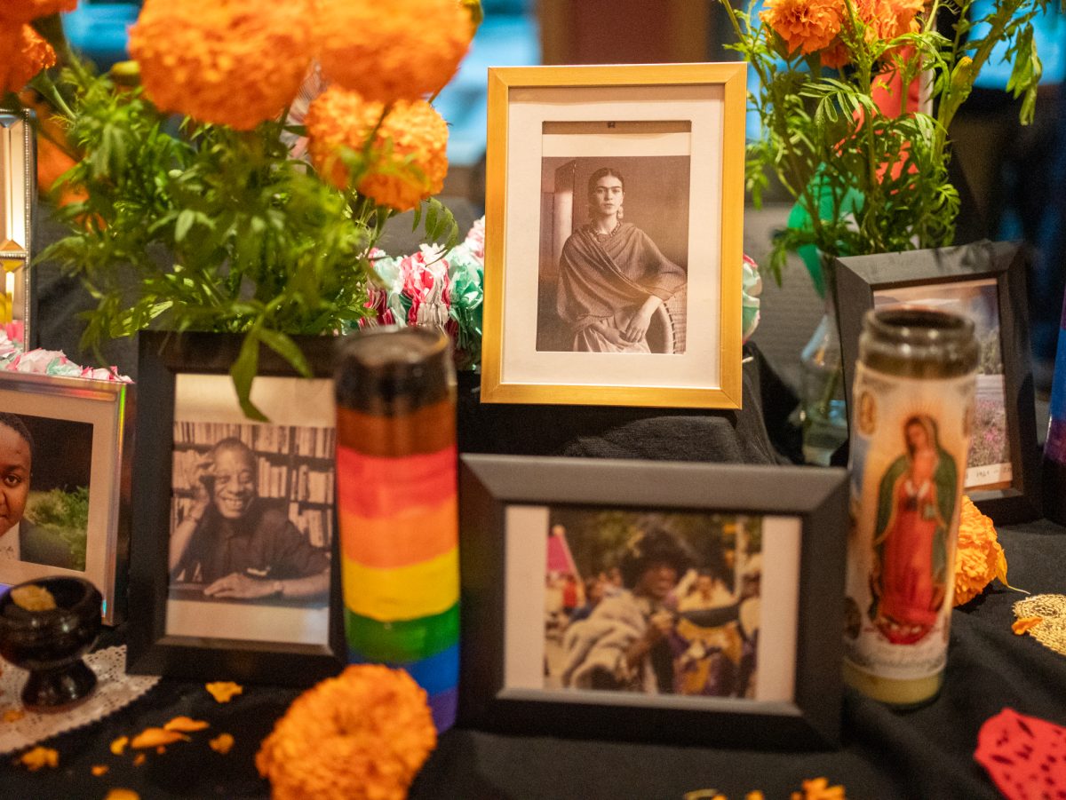 Photos of LGBTQIA ancestors are displayed on the Positive Images ofrenda during the SRJC Dia de los Muertos celebration in Bertolini Hall on Oct. 21.