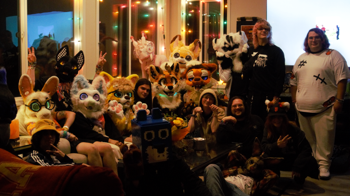 Members of the furry community pose for a group photo during the afterparty of Sonoma County's fourth furry car meet on Oct. 4.