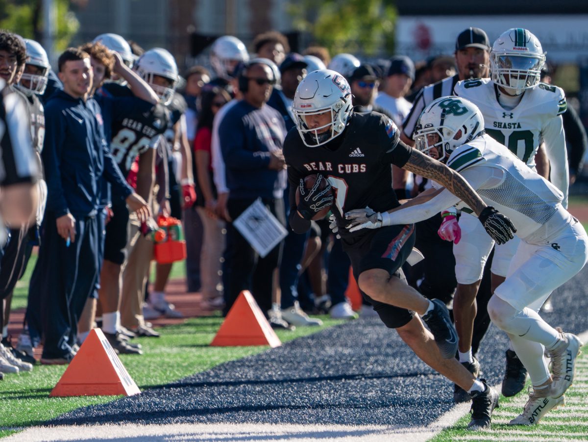 Freshman wide receiver Sean Randall runs down the field to stay inbounds during the game against Laney on Saturday, Sept. 27 at home.