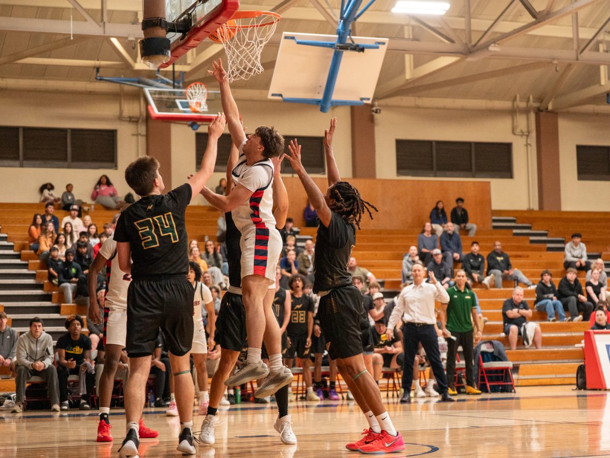 Sophomore forward Audon Forgus fights through Storm defense for two against Napa Valley College on Tuesday, Nov. 11 at home.