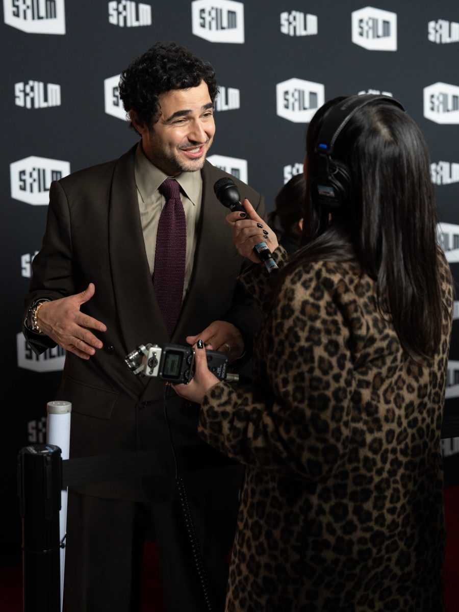 Fashion designer and creative director Zac Posen (left) smiles as he becomes an impromptu guest on Erin Lim's podcast "Bitch Talk" Dec. 8, 2025 at the SFFILM Awards at the Fort Mason Center for Arts and Culture. 