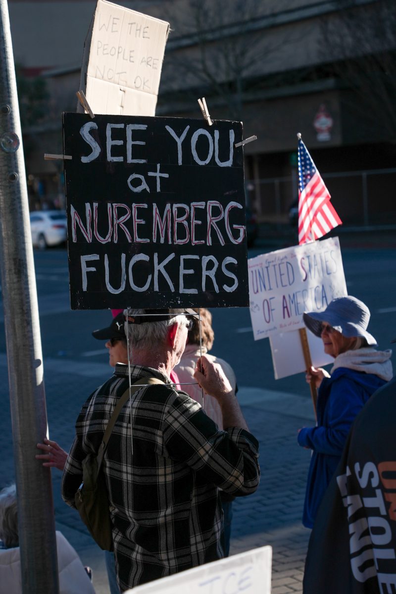Demonstrators hold signs, some with references to Nazi Germany and the gestapo, including a sign reading "See you at Nuremberg, f---ers," during a protest after the killing of Alex Pretti at Santa Rosa's Courthouse Square on Jan. 24.