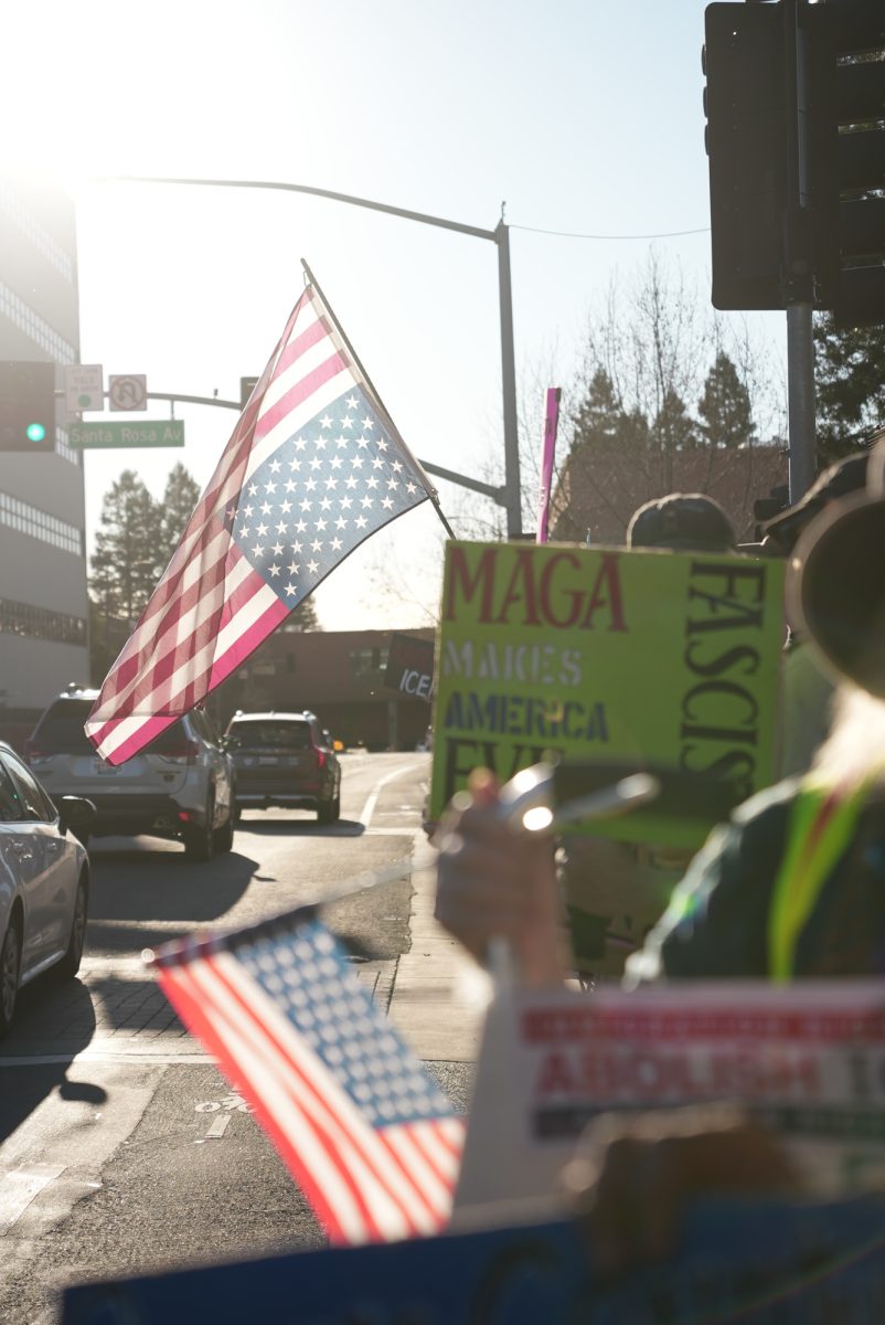 Protesters wave American flags upside down, a signal of distress, during an emergency protest of ICE after the killing of Alex Pretti at Santa Rosa's Courthouse Square on Jan. 24.