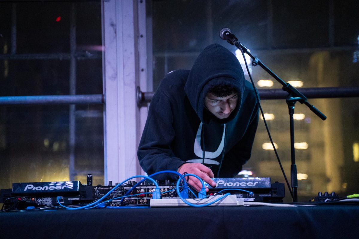 DJ ninekay sets the tone with energetic beats from Devstacks, swapa and maxon before headliner myspacemark takes the stage Dec. 4, 2025 at the DNA Lounge in San Francisco.