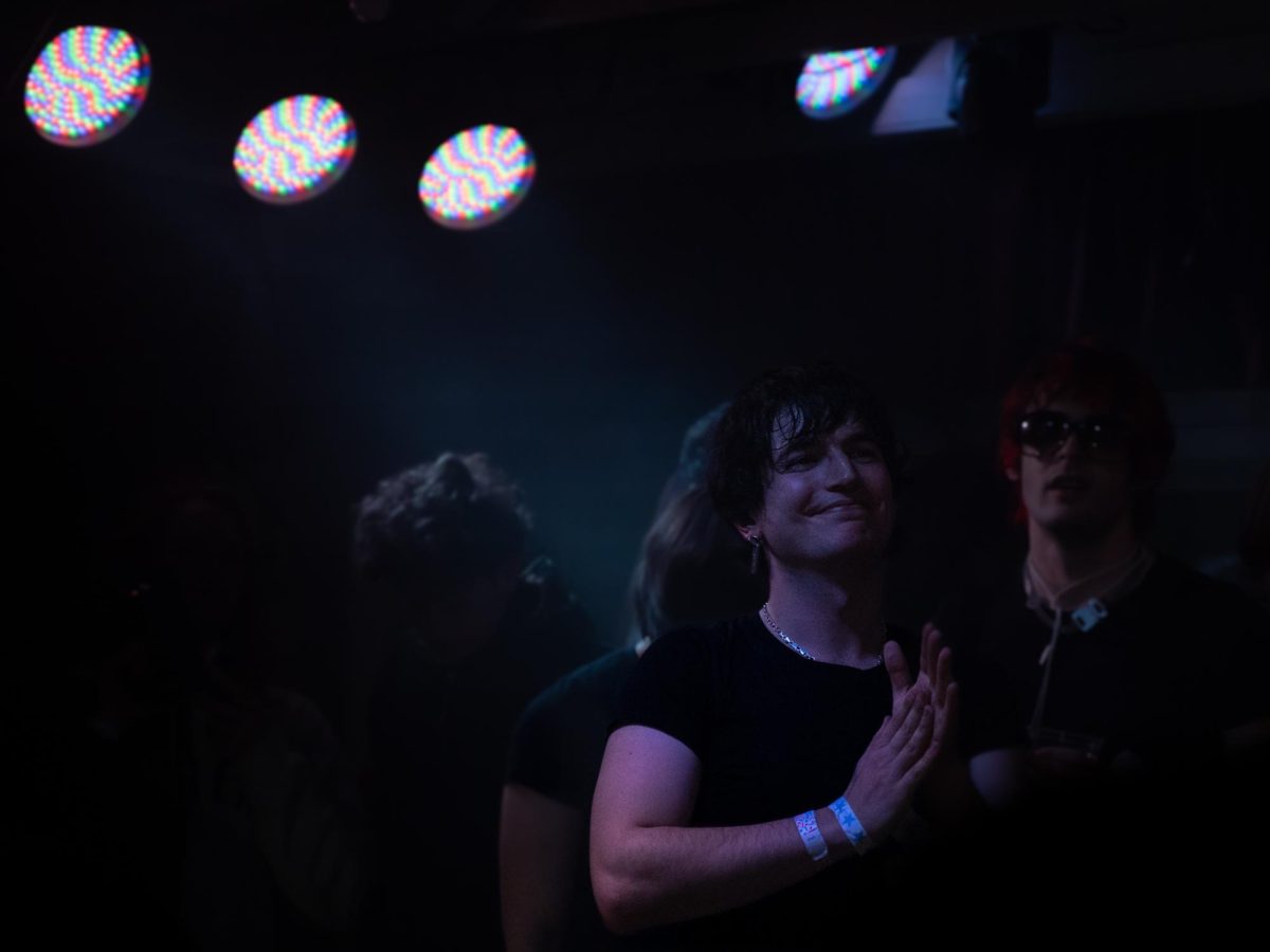 Jack O'Brien, myspacemark's videographer, spends nearly the entire show smiling and cheering his friend on Dec. 4, 2025 at the DNA Lounge in San Francisco.
