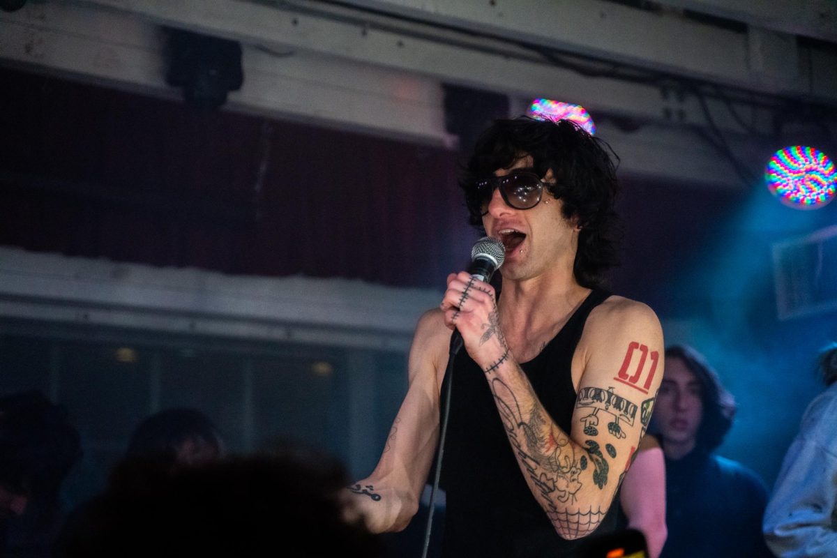 Though the packed room is dimly lit, myspacemark keeps his sunglasses on almost the entire duration of his headliner show Dec. 4, 2025 at the DNA Lounge in San Francisco.
