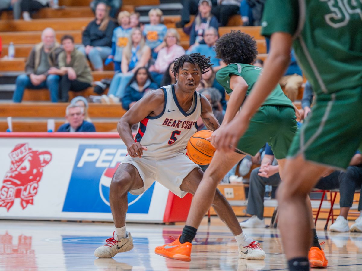 Sophomore guard Gavin Cook-Whisenton looks for an open pass against Diablo Valley College on Friday, Jan. 30 at home.