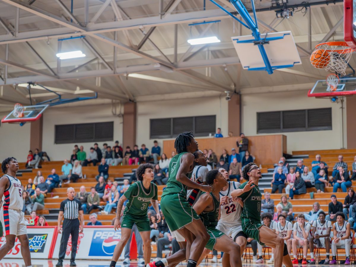 Sophomore guard Gavin Cook-Whisenton, left, watches as his free throw goes in to tie the game in the fourth with seconds left against Diablo Valley College on Friday, Jan. 30 at home.