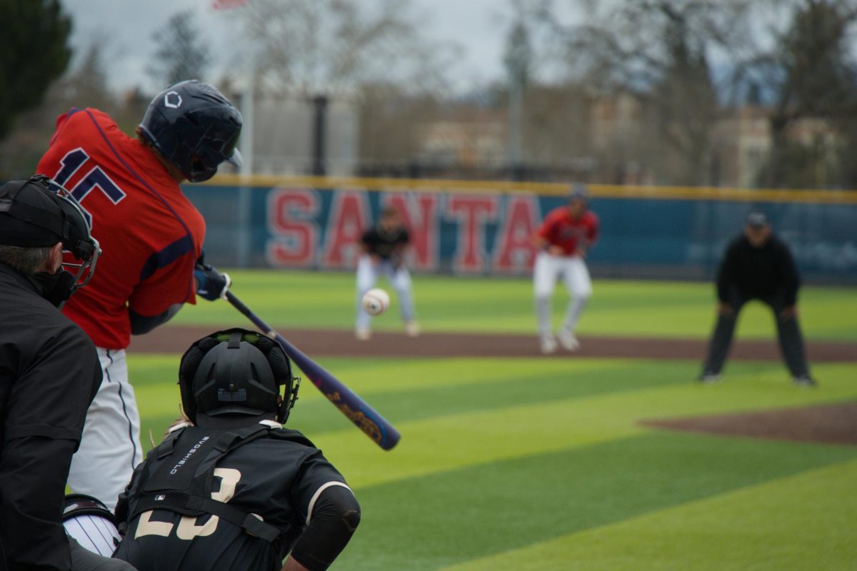Bear Cubs shortstop picks up one of his three hits on the day against College of Marin on Saturday, Feb. 14 at home. (Oliver Kindt / For The Oak Leaf)