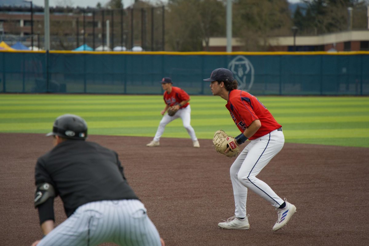Bear Cubs infielders Trevor Schlafer (left) and J.T. Summers (right) ready themselves against College of Marin on Saturday, Feb. 14 at home. (Oliver Kindt / For The Oak Leaf)