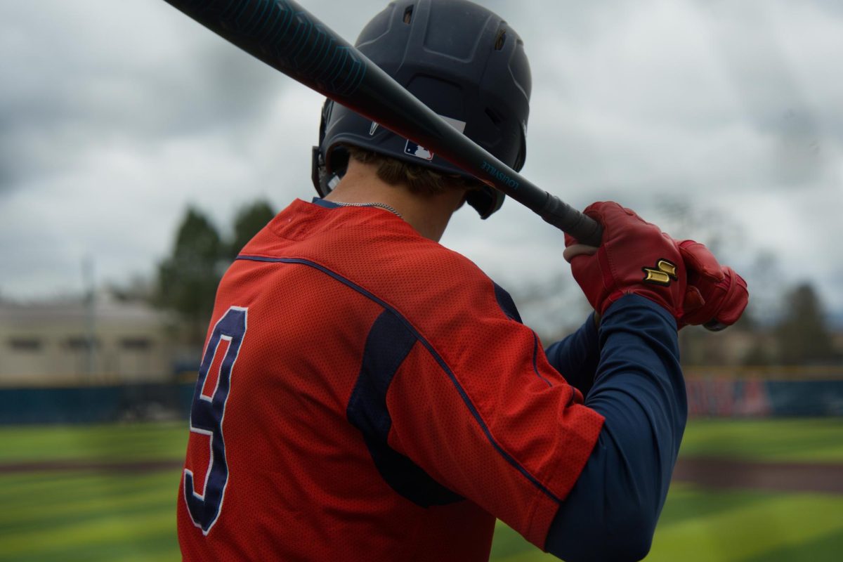 Bear Cubs outfielder Will Tokar times up the College of Marin pitcher in the on-deck circle on Saturday, Feb. 14 at home. (Oliver Kindt / For The Oak Leaf)