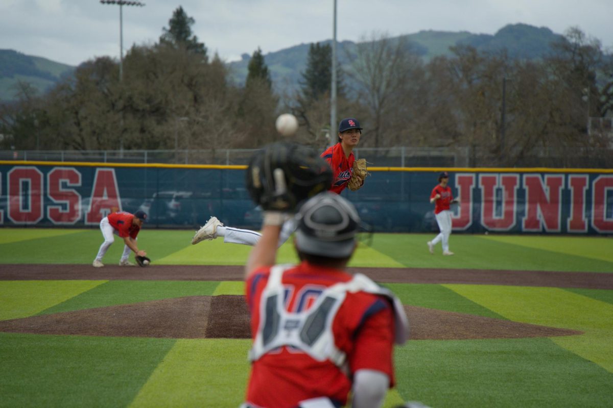 Bear Cubs pitcher Jayden Hunt warms up in the top of the seventh before pitching four scoreless innings against College of Marin on Saturday, Feb. 14 at home. (Oliver Kindt / For The Oak Leaf)