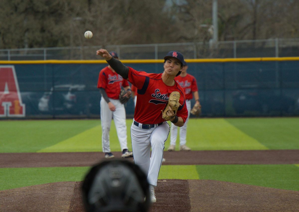 Bear Cubs pitcher Jayden Hunt warms up in the top of the seventh before pitching four scoreless innings against College of Marin on Saturday, Feb. 14 at home. (Oliver Kindt / For The Oak Leaf)