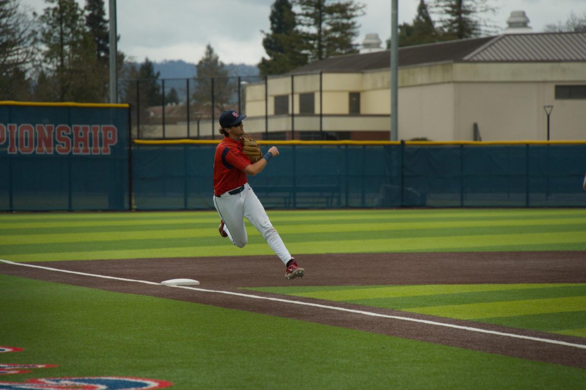 Bear Cubs third baseman Caze Derammelaere fires to first on the run against College of Marin on Saturday, Feb. 14 at home. (Oliver Kindt / For The Oak Leaf)
