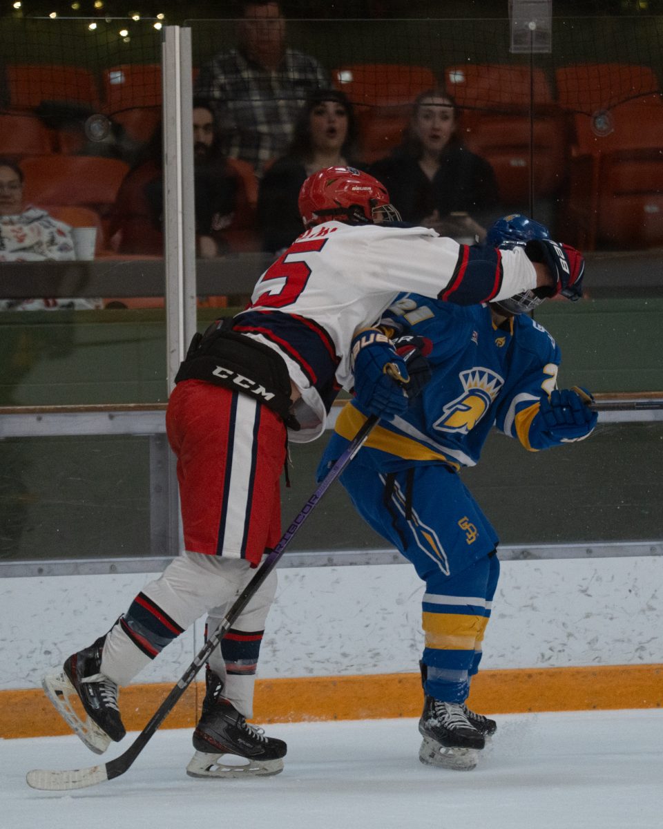 Polar Bear defenseman and winger Owen Hamblin takes a swing at Reno defenseman Jason Kodner at Snoopy’s Home Ice Friday, Feb. 20, 2026.