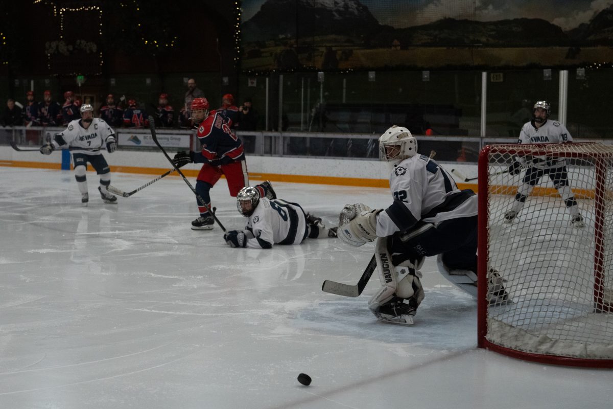 All eyes on a loose puck in Wolf territory Friday, Feb. 6 at Snoopy's Home Ice.