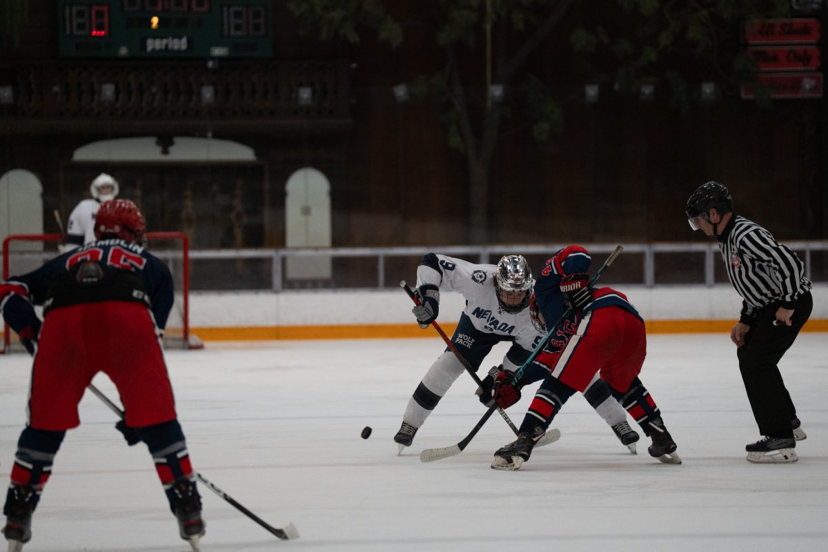 Wolfpack forward Jack Eber and Polar Bears winger Logan Koop face off after a Wolfpack goal in the second period Friday, Feb. 6 at Snoopy's Home Ice.