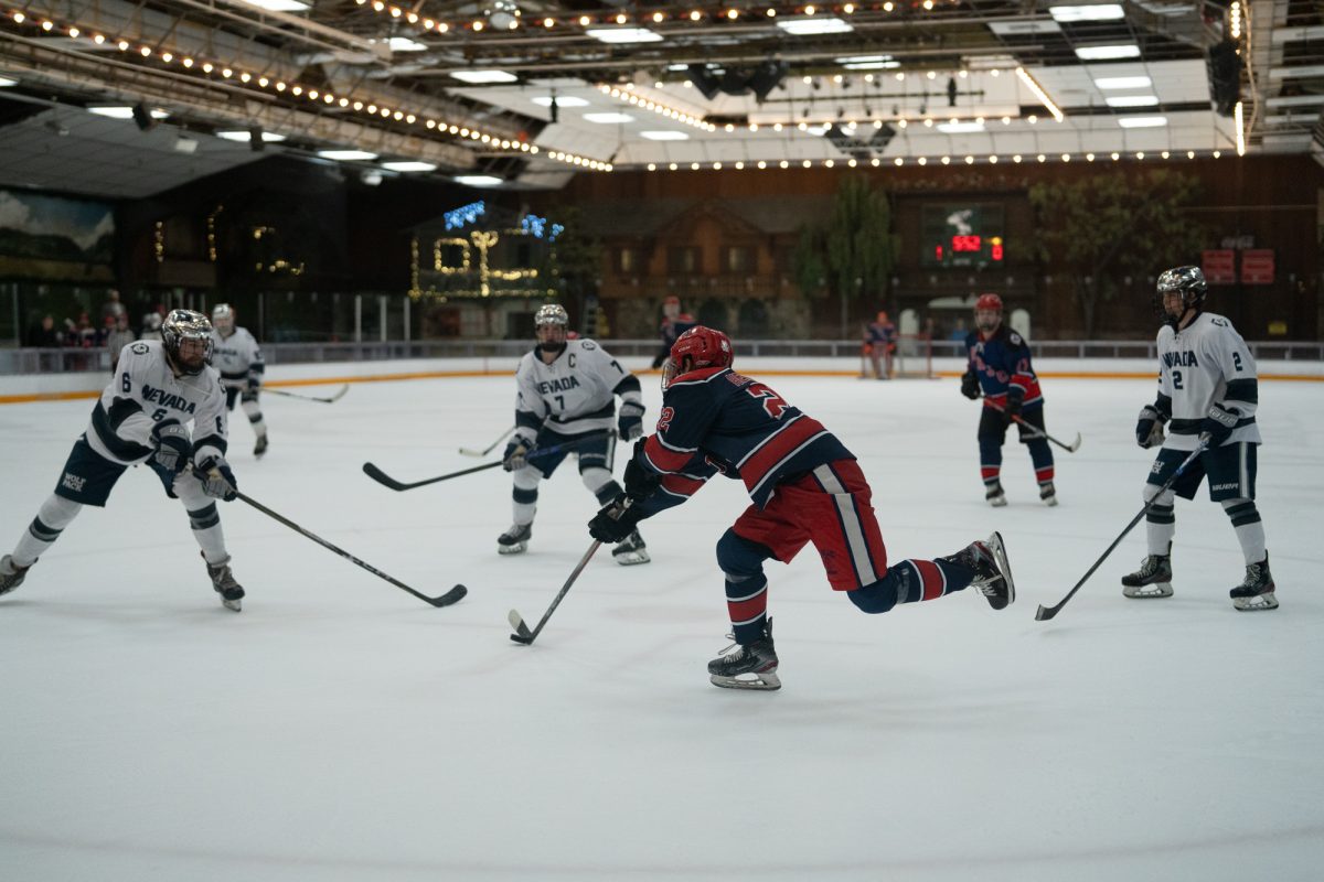 Polar Bear winger Antonio Hernandez, surrounded by Wolves, approaches the goal Saturday, Feb. 7 at Snoopy's Home Ice.