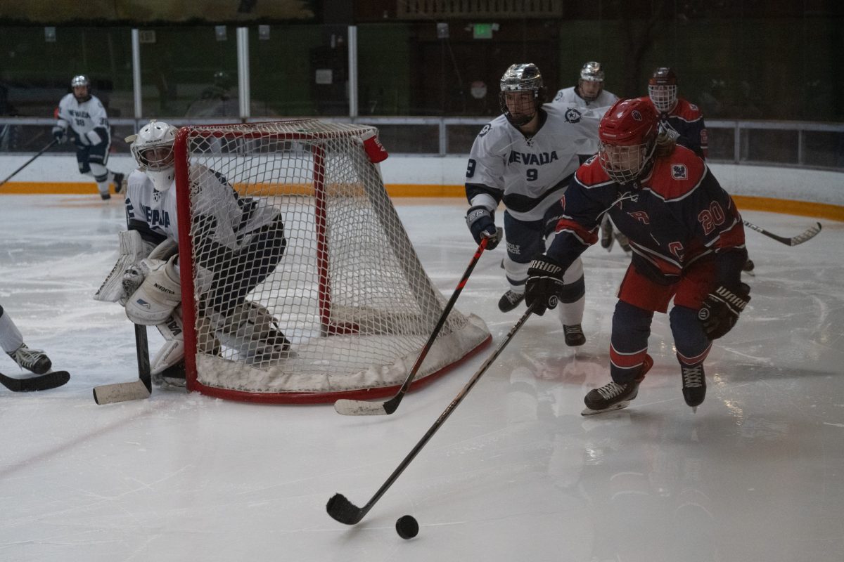 Polar Bears center Kai Krombholz plays behind the Wolfpack's net Saturday, Feb. 7 at Snoopy's Home Ice.
