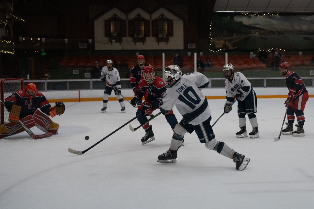Wolfpack forward Dylan Towle shoots on the Polar Bear's goal in the last few minutes of the game Saturday, Feb. 7 at Snoopy's Home Ice.