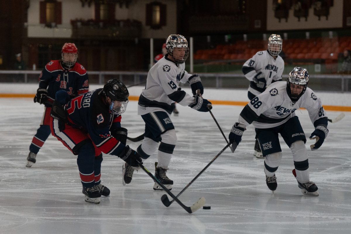 The Wolfpack and Polar Bears claw for possession Saturday, Feb. 7 at Snoopy's Home Ice.