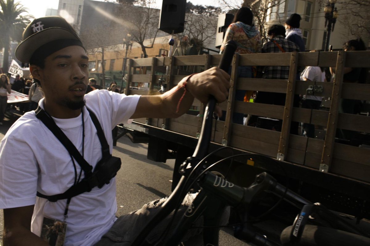 During the ICE Out march, a protester does a wheelie while riding a bike to San Francisco City Hall from Market Street Friday, Jan. 30, 2026.