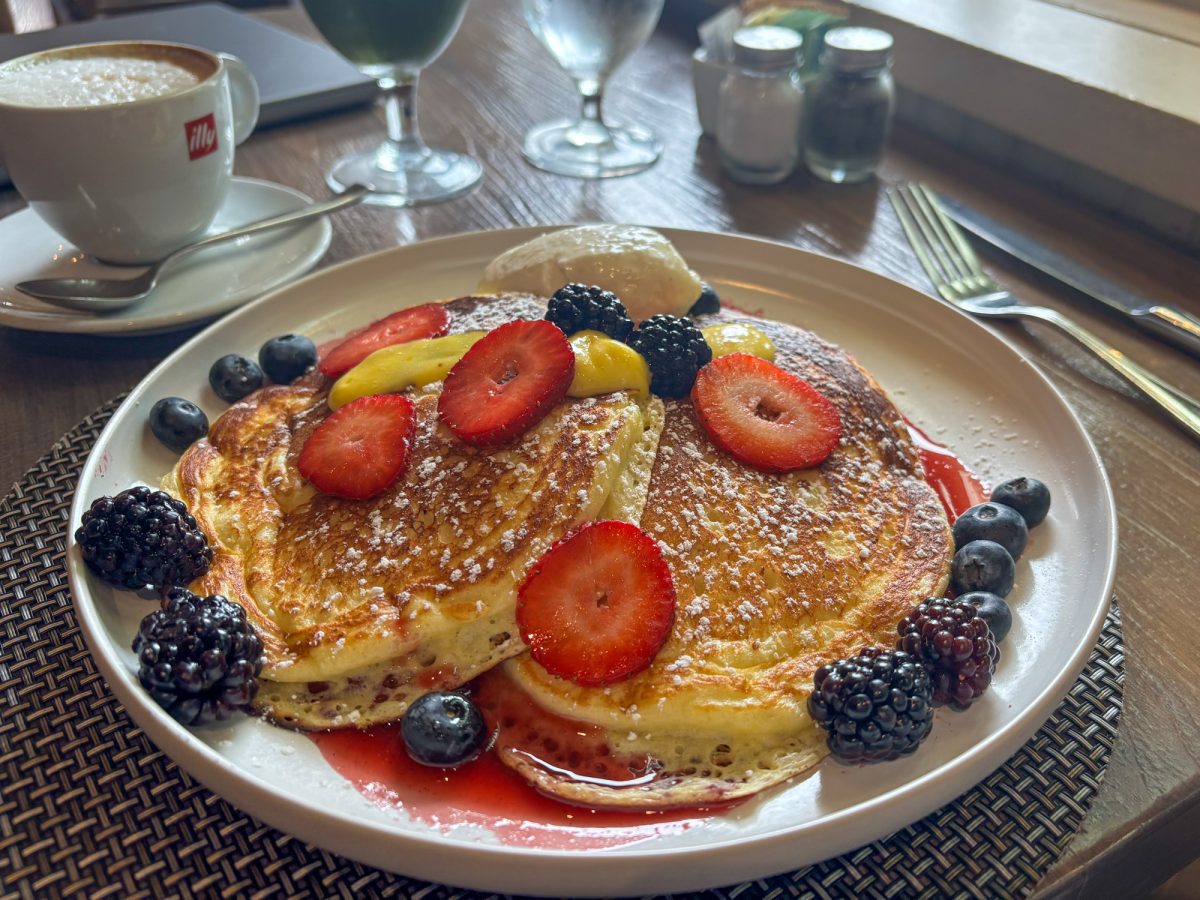 A stack of lemon ricotta pancakes is presented with lemon curd, mixed berries and mascarpone on top and lightly dusted with powdered sugar as part of the Restaurant Week offerings at John Ash on Feb. 23, 2026 in Santa Rosa.