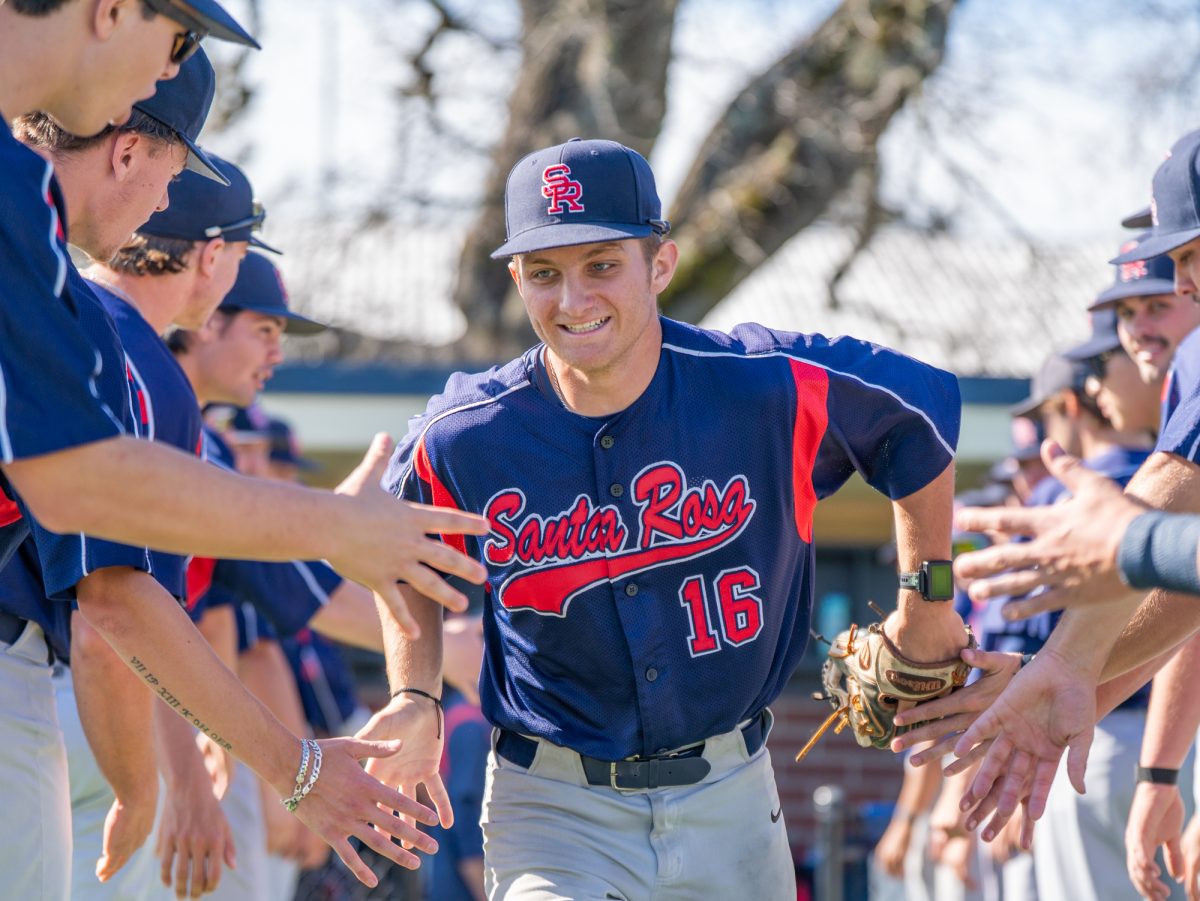 Freshman second baseman Trevor Schlafer runs out to the field ahead of the game against Chabot on Friday, Feb. 13 at home.