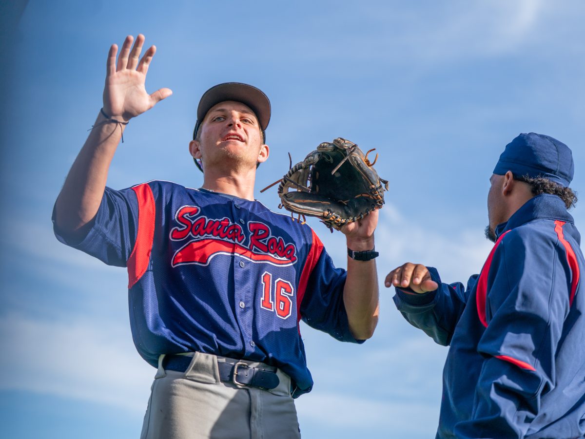 Santa Rosa second baseman Trevor Schlafer walks back to the dugout after preventing two runners from scoring in the fifth by fielding a ball on his knees and throwing the runner out to end the inning against Chabot on Friday, Feb. 13 at home.