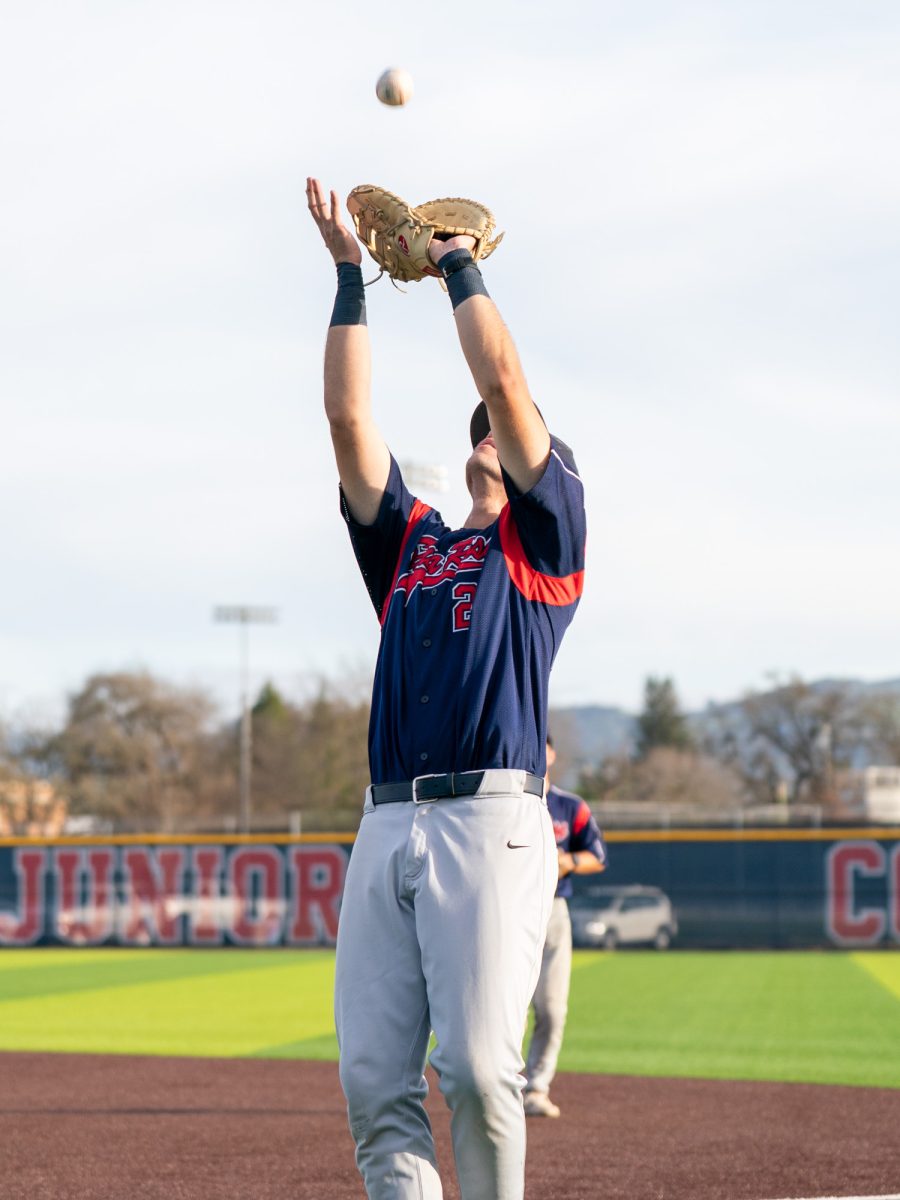 Sophomore second baseman J.T. Summers prepares to catch an infield fly to get the batter out against Chabot on Friday, Feb. 13 at home.