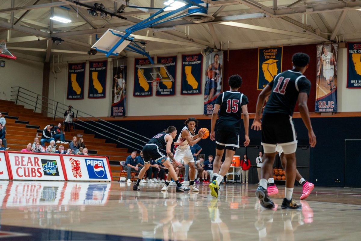 Bear Cubs sophomore guard Amari Gray looks for a path around Sierra freshman AJ Cook Feb. 10 at Haehl Pavilion.