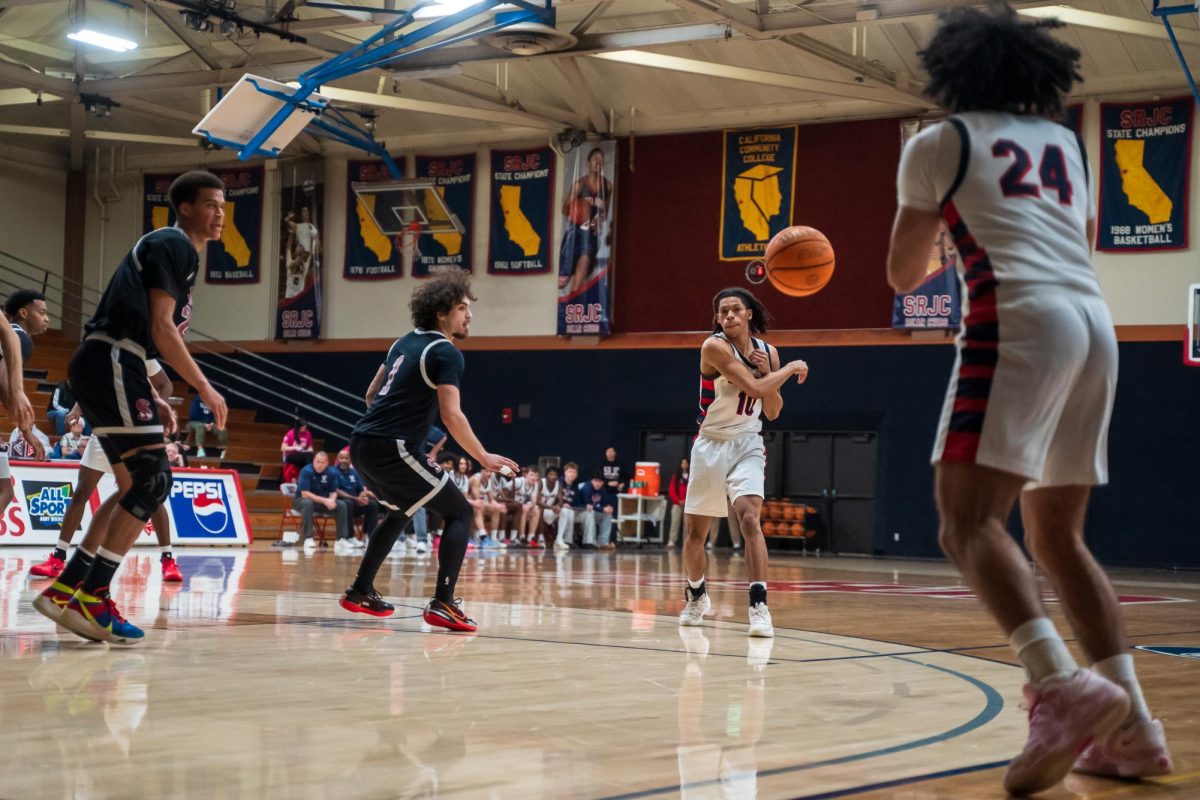 Bear Cubs sophomore guard Amari Gray throws to sophomore forward Vincent Jackson during a match against Sierra Feb. 10 at Haehl Pavilion.