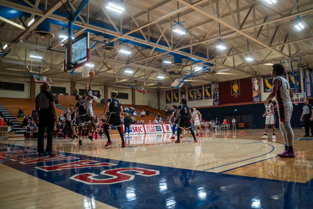 Bear Cubs sophomore forward Travis Hightower goes for one of his many successful layouts during a match against Sierra Feb. 10 at Haehl Pavilion.