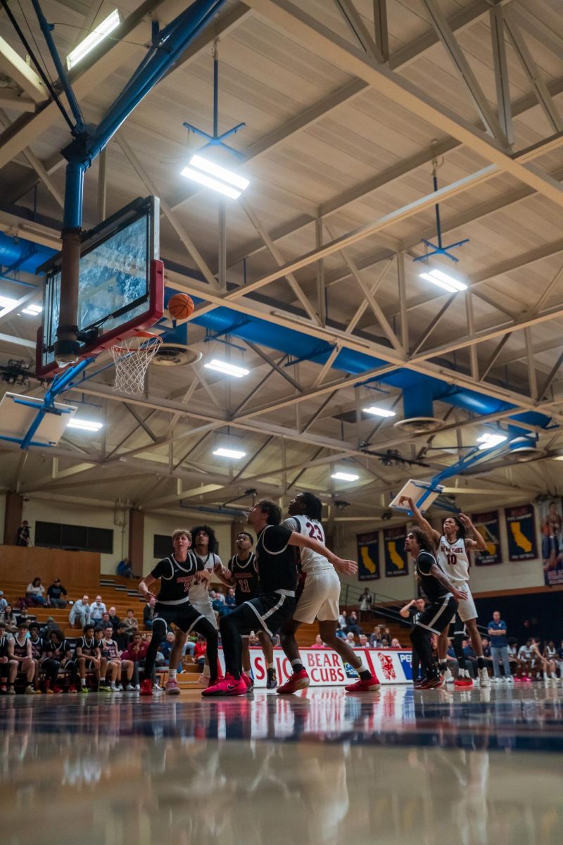 Bear Cubs and Wolverines watch as sophomore guard Amari Gray goes up for a free throw against Sierra Feb. 10 at Haehl Pavilion.
