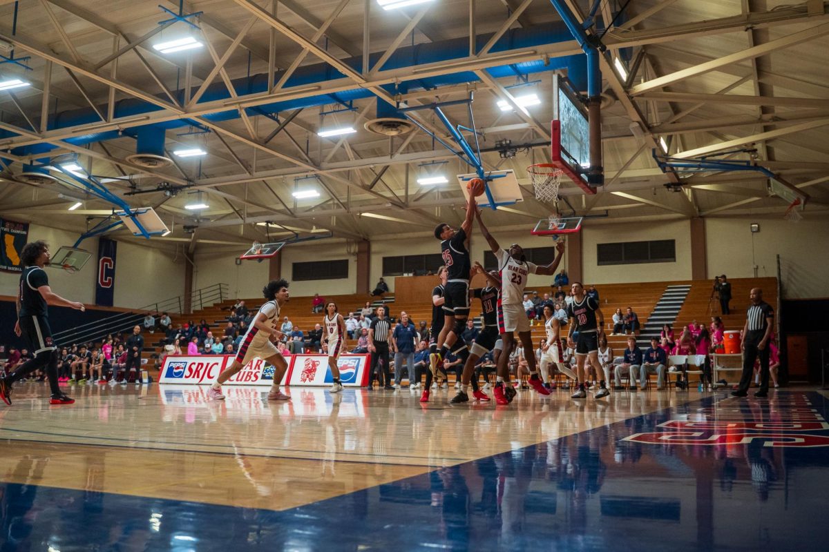 Bear Cubs sophomore forward Travis Hightower attempts to block a layup from Sierra sophomore Alon Garret Feb. 10 at Haehl Pavilion.